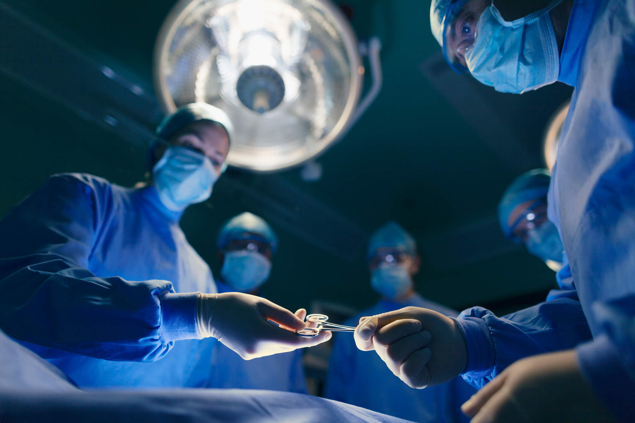 Group of surgeons performing a wrong-site surgery.