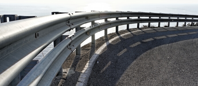 Metal guardrail along road edge