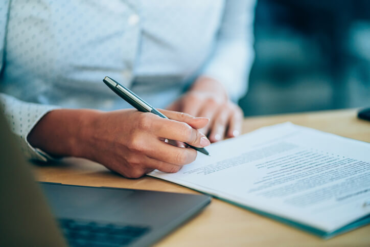 Woman filling out personal injury legal documents