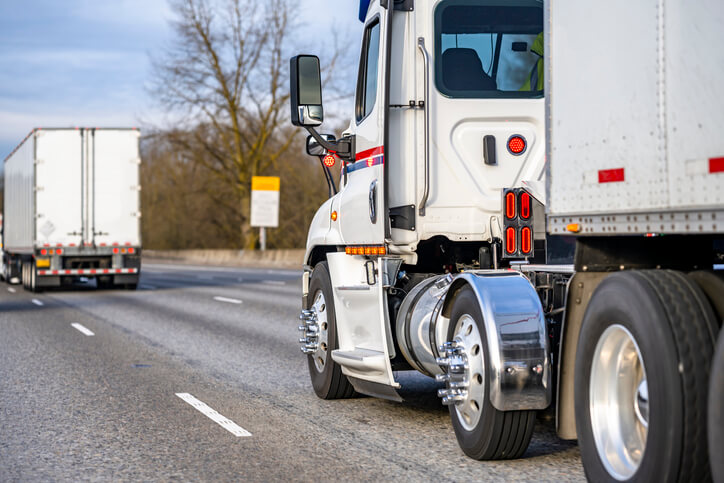 Truck driving down the road