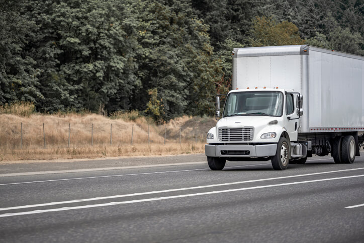 Truck driving down the road