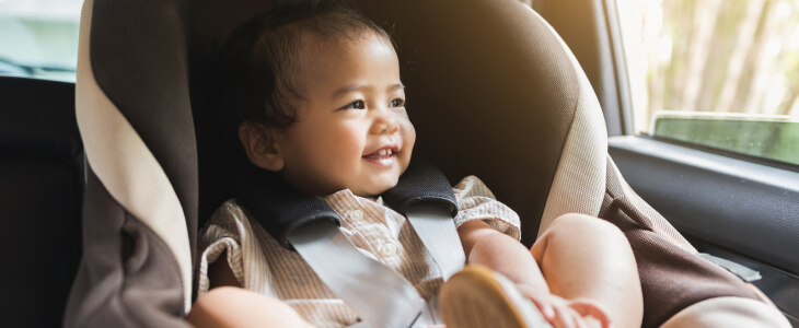 Cute baby in a car seat